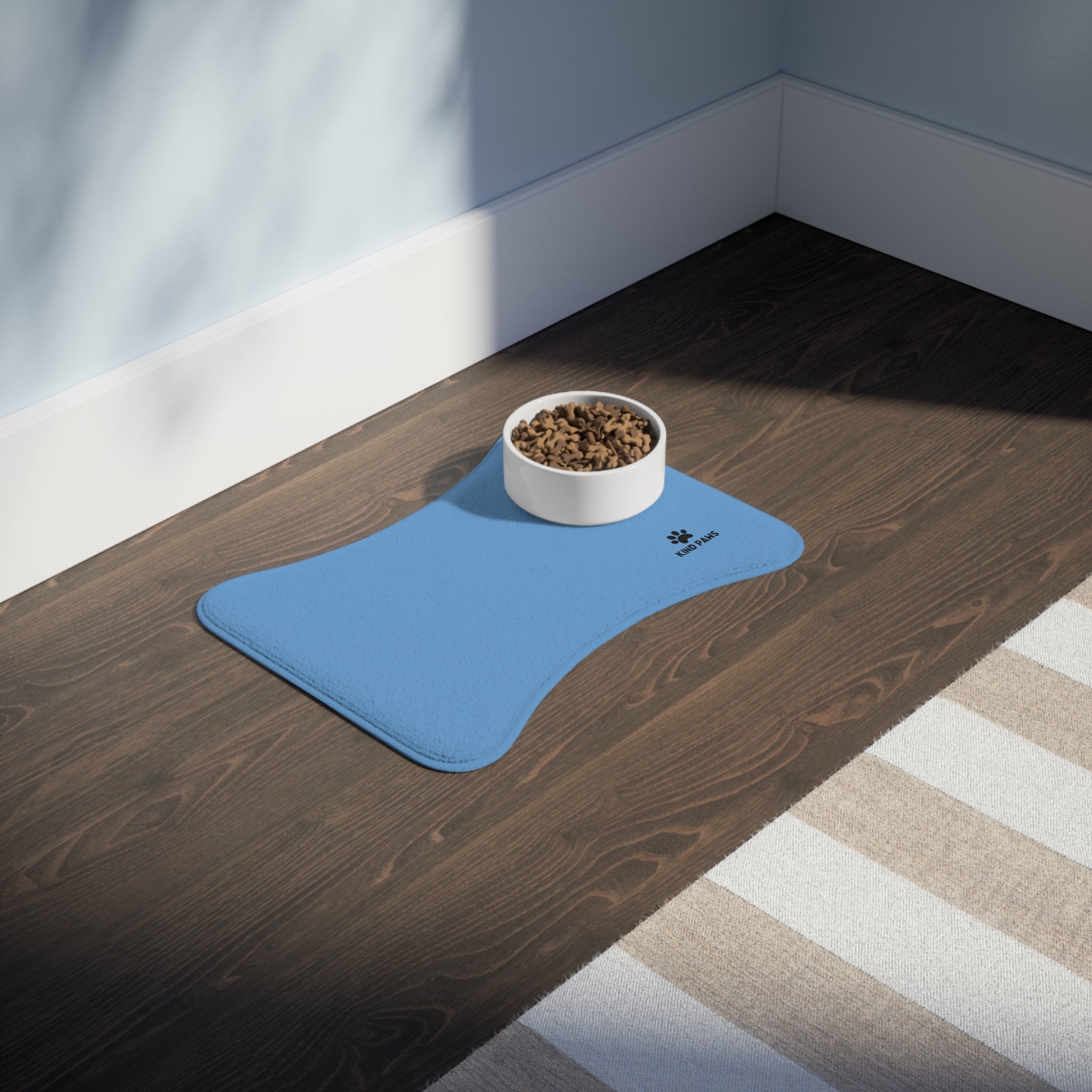 Blue Bone-Shaped Pet Feeding Mat – Non-Slip Waterproof Placemat with ‘Kind Paws’ Logo